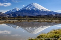 Volcanoes Parinacota and Pomerape, together called Payachata, reflecting in Cotacotani Lagoons