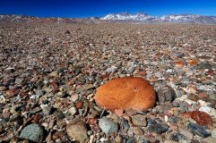 Gravel plains at the high Atacama desert near Salar de Maricunga, with Andes mountain range
