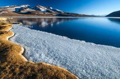 Frozen Laguna Santa Rosa, Nevado Tres Cruces national park in the Altiplano of Chile