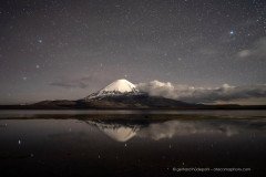 Parinacota volcano and stars reflecting in Lago Chungara, Chile
