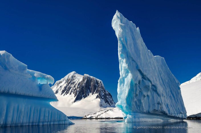 Spectacular iceberg and mountains near Port Lockroy, Antarctic Peninsula
