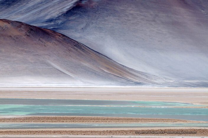 Landscape of the Chilean desertic Altiplano at Salar de Aguas Calientes. The soft colors appear like a painting