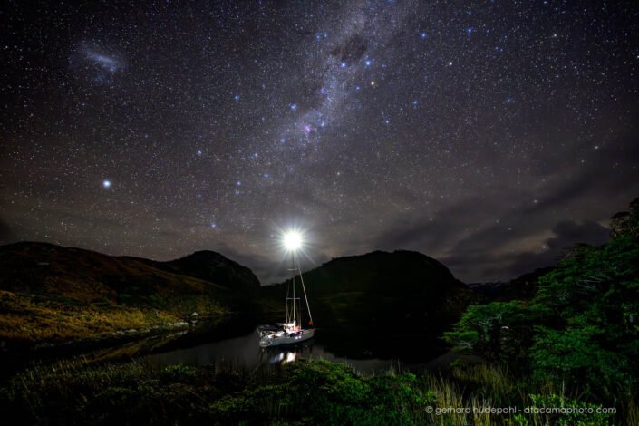 Sailing boat at night under the Milky Way, Patagonia