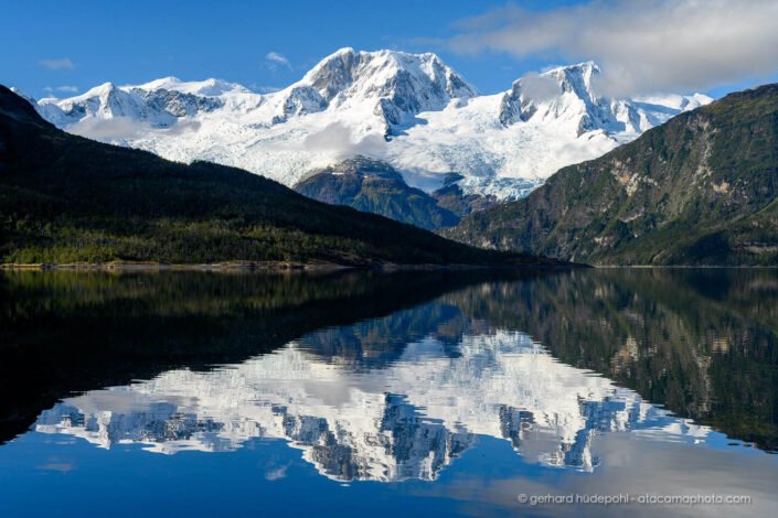 Cerro El Paso reflecting in fjord Brookes, Cordillera Darwin Patagonia Chile