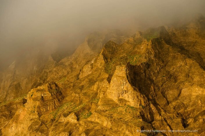 Morning fog in the rugged cliffs of San Cristobal Island, Galapagos