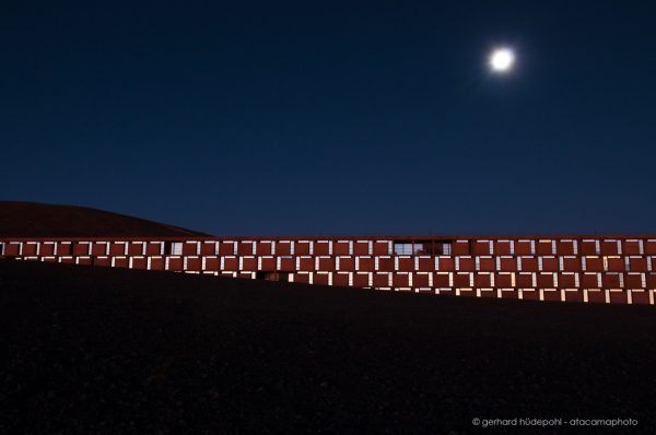 Paranal observatory Residencia at dusk with moon